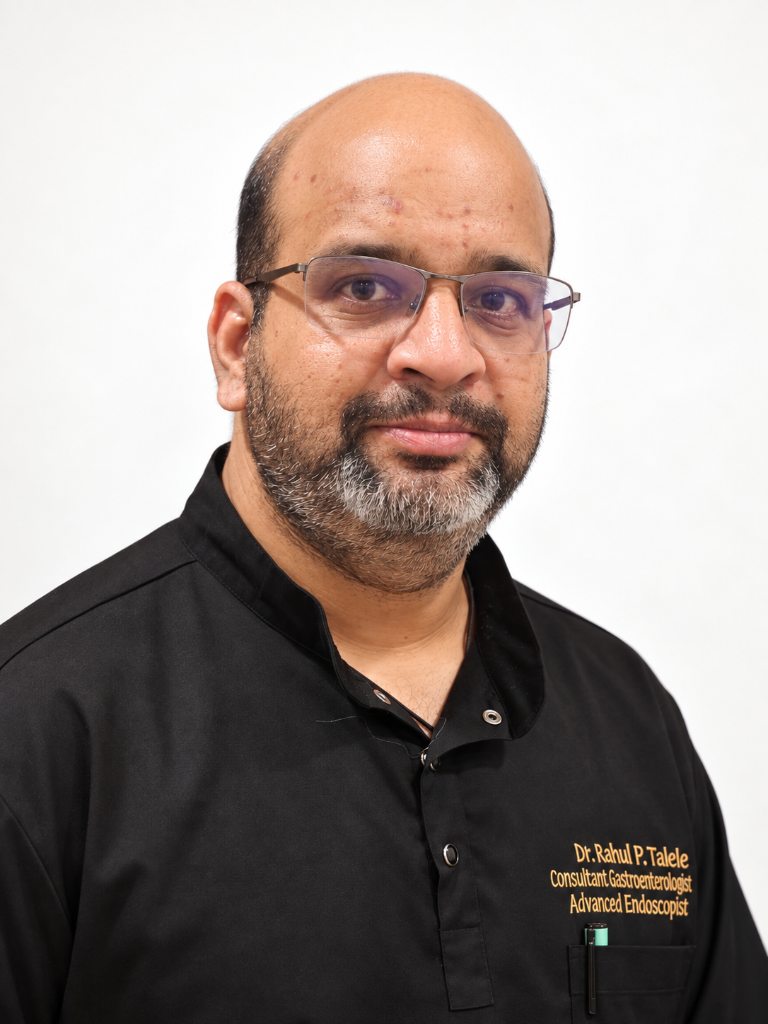 Dr Rahul Talele in a three-quarter portrait, wearing the embroidered GastroCare consultant shirt